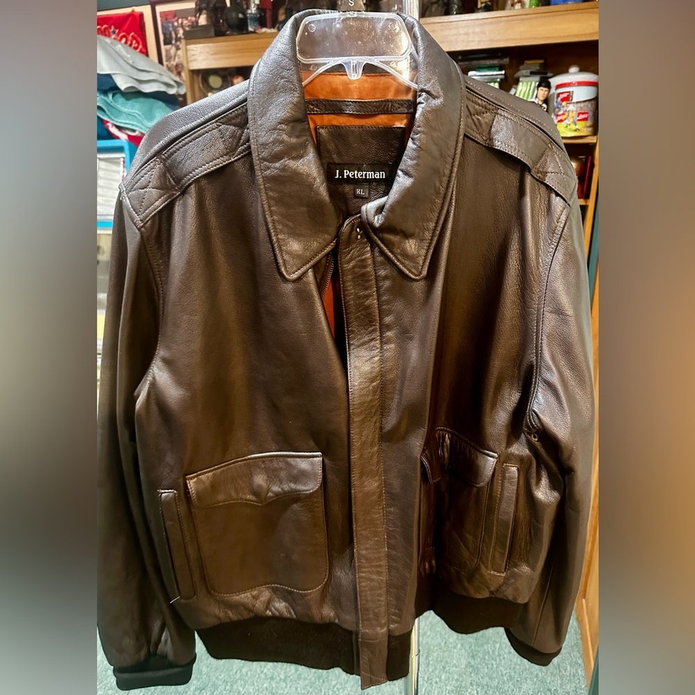 J. Peterman Jacket Mens XL.
Brown leather Pilot Bomber jacket.   
Classic style